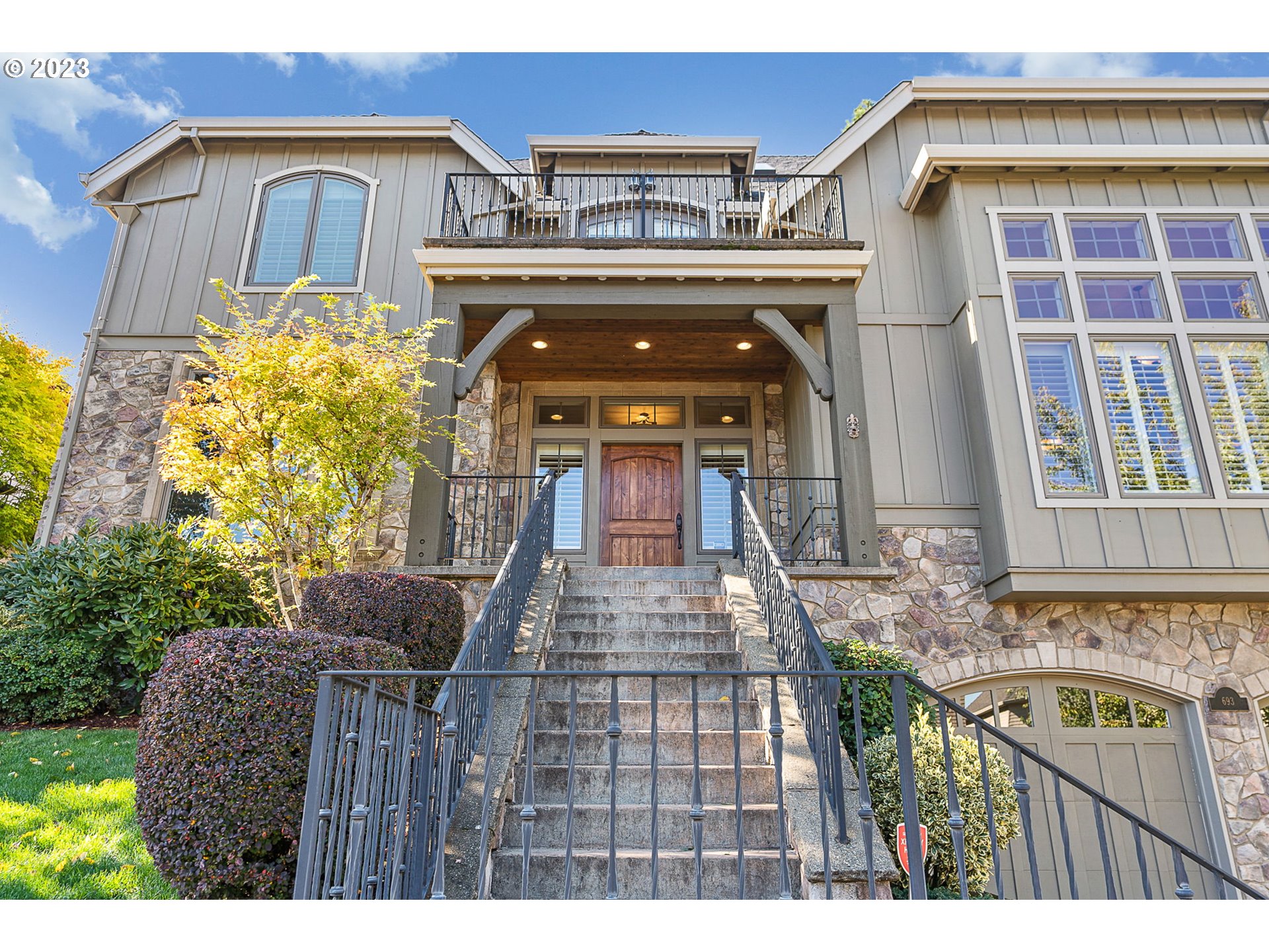 693 Southwest 68th Terrace Portland, OR 97225 - Photo 2 of 48 a view of a wooden door with a large tree