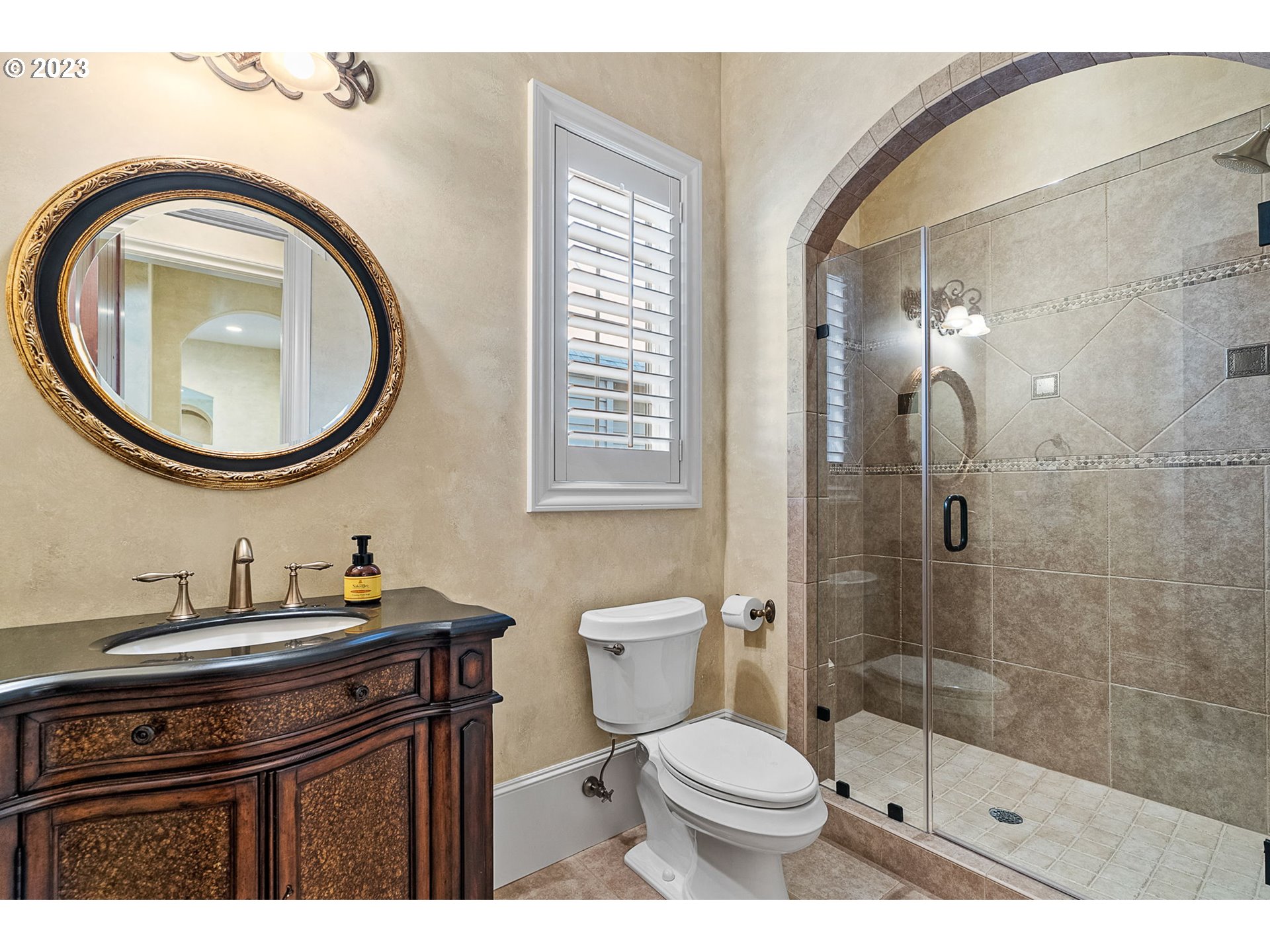 693 Southwest 68th Terrace Portland, OR 97225 - Photo 24 of 48 a bathroom with a sink a toilet and a mirror