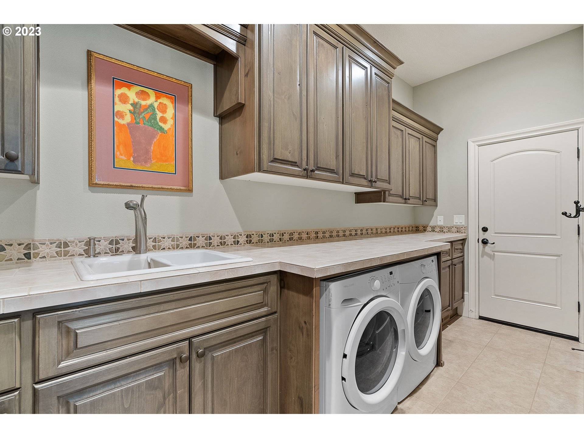 693 Southwest 68th Terrace Portland, OR 97225 - Photo 27 of 48 a utility room with sink dryer and washer