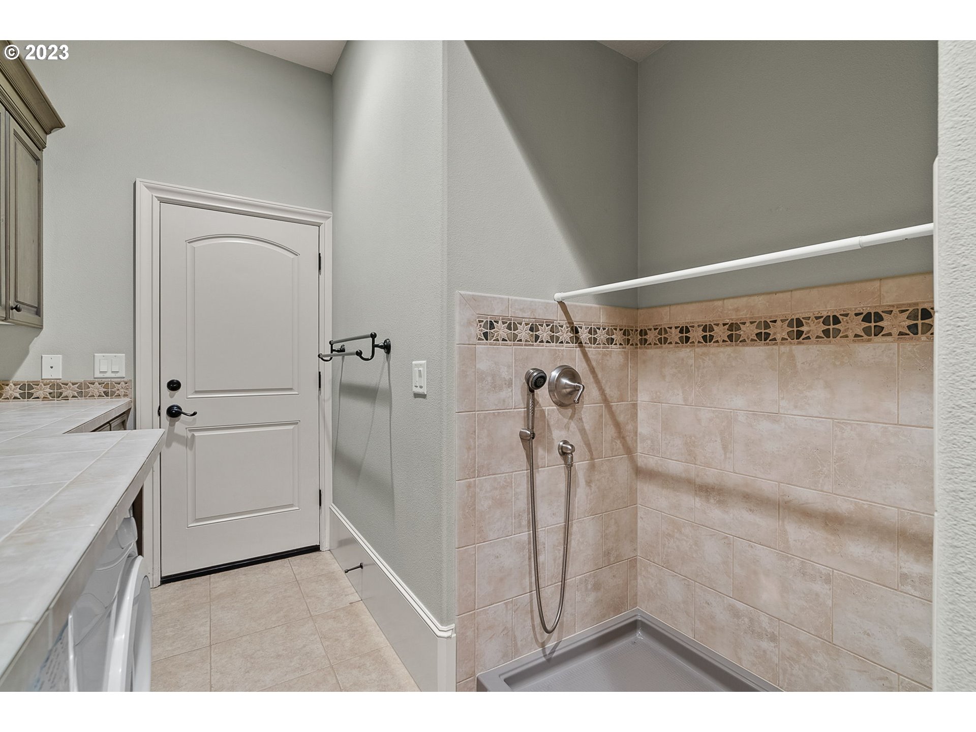 693 Southwest 68th Terrace Portland, OR 97225 - Photo 28 of 48 a bathroom with a bathtub and a shower