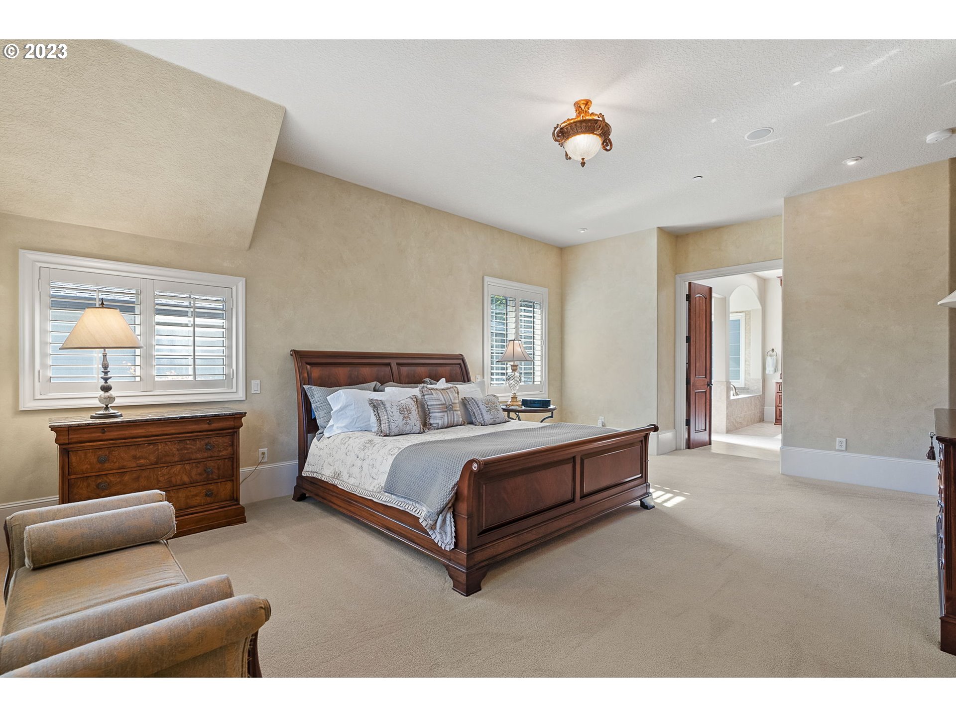 693 Southwest 68th Terrace Portland, OR 97225 - Photo 29 of 48 a spacious bedroom with a bed and furniture