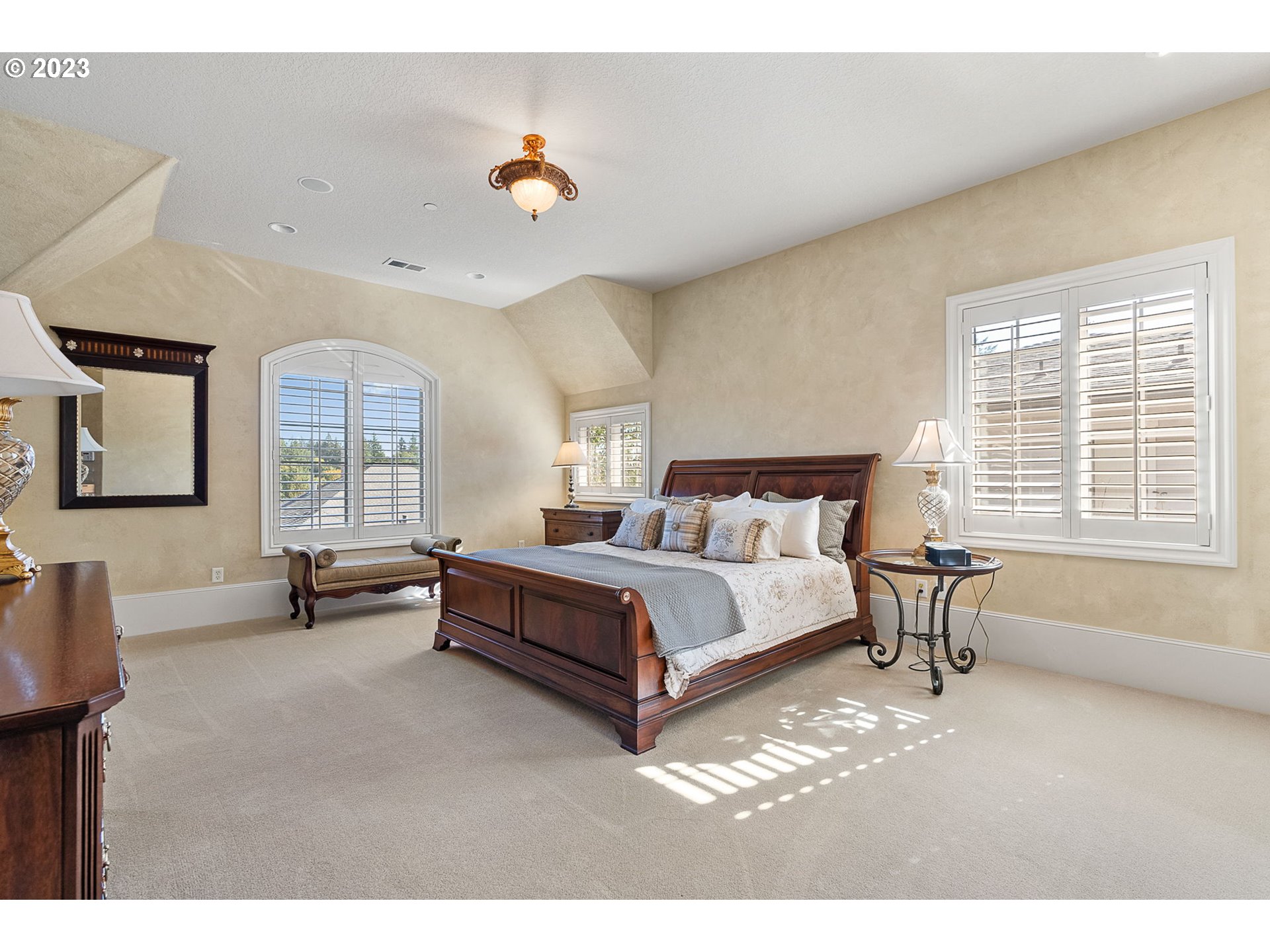 693 Southwest 68th Terrace Portland, OR 97225 - Photo 31 of 48 a bedroom with a bed and a large window