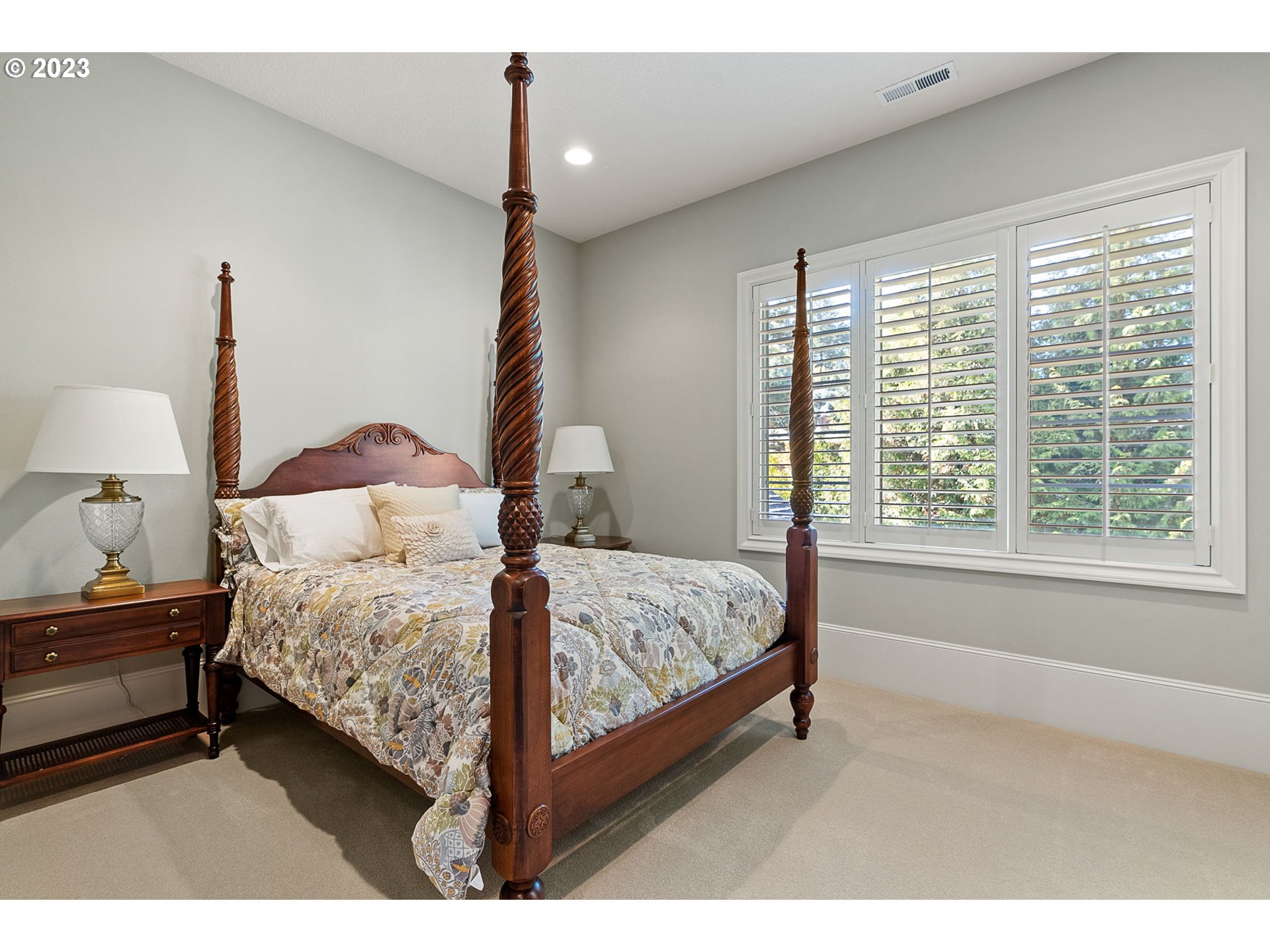 693 Southwest 68th Terrace Portland, OR 97225 - Photo 39 of 48 a bedroom with a bed lamp and window