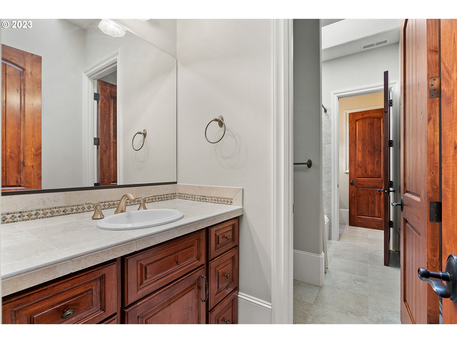 693 Southwest 68th Terrace Portland, OR 97225 - Photo 41 of 48 a bathroom with a sink and a mirror