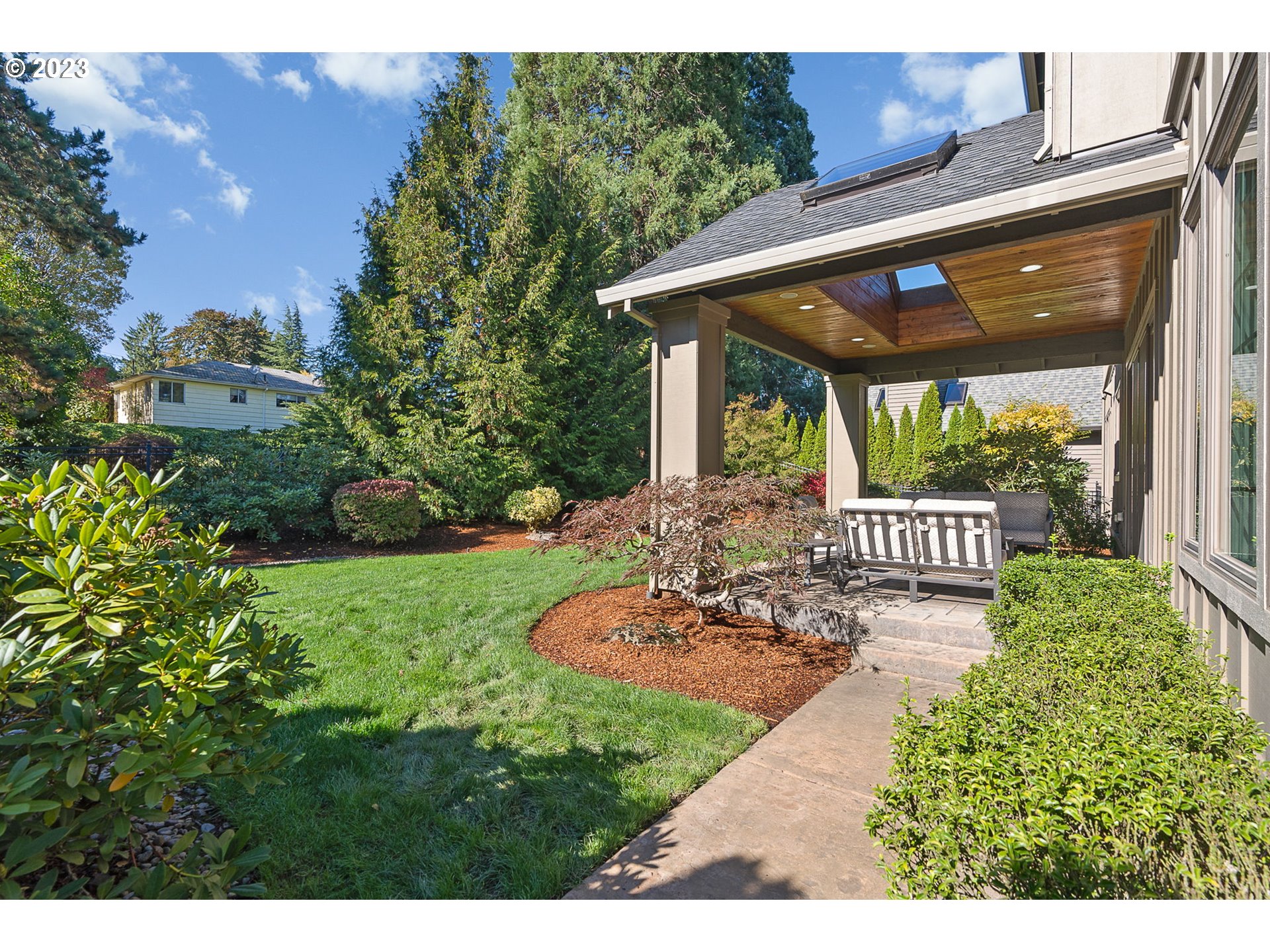 693 Southwest 68th Terrace Portland, OR 97225 - Photo 44 of 48 a view of a patio with table and chairs potted plants with wooden floor and fence