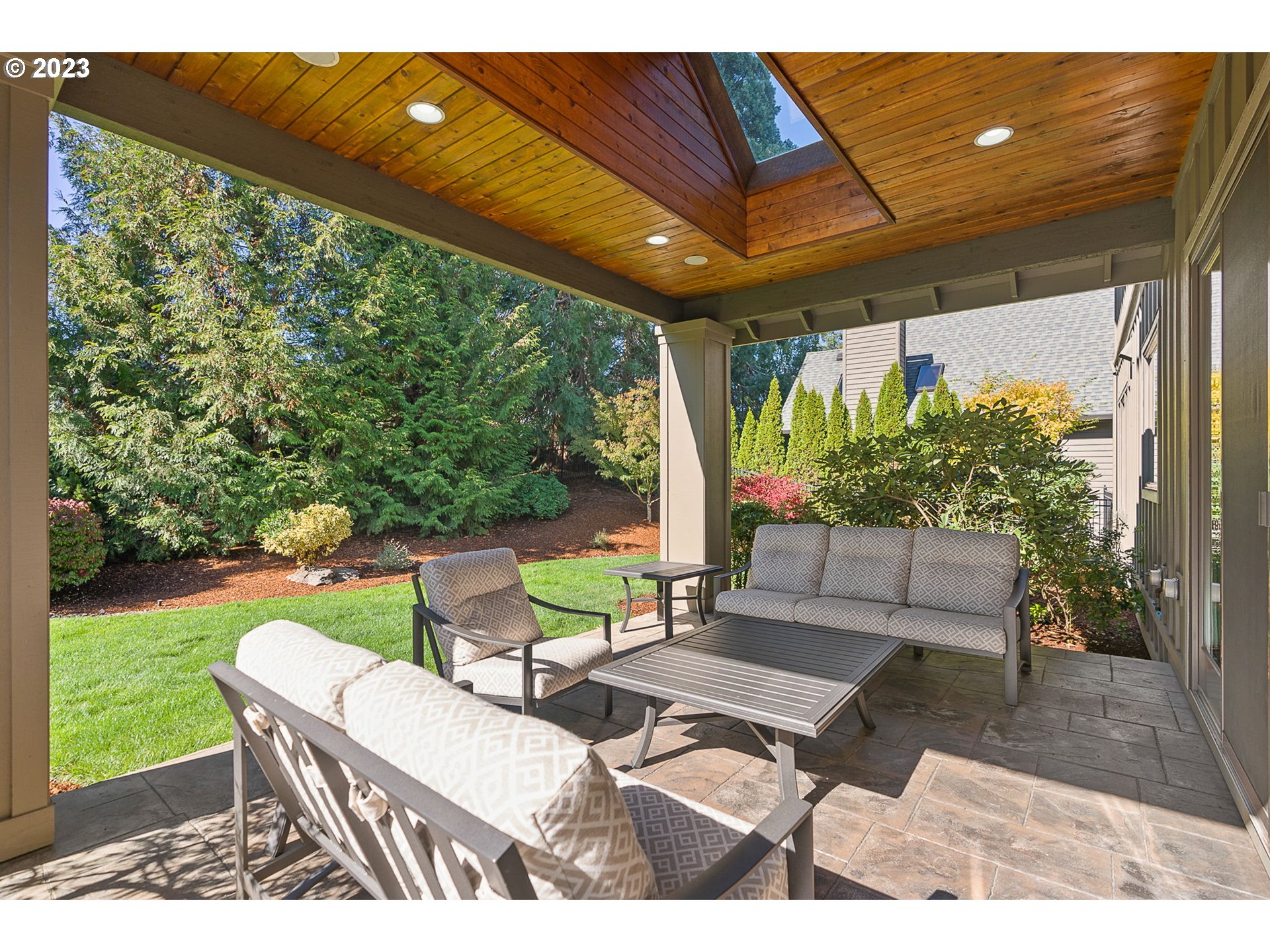 693 Southwest 68th Terrace Portland, OR 97225 - Photo 46 of 48 a patio with yard glass top table and chairs