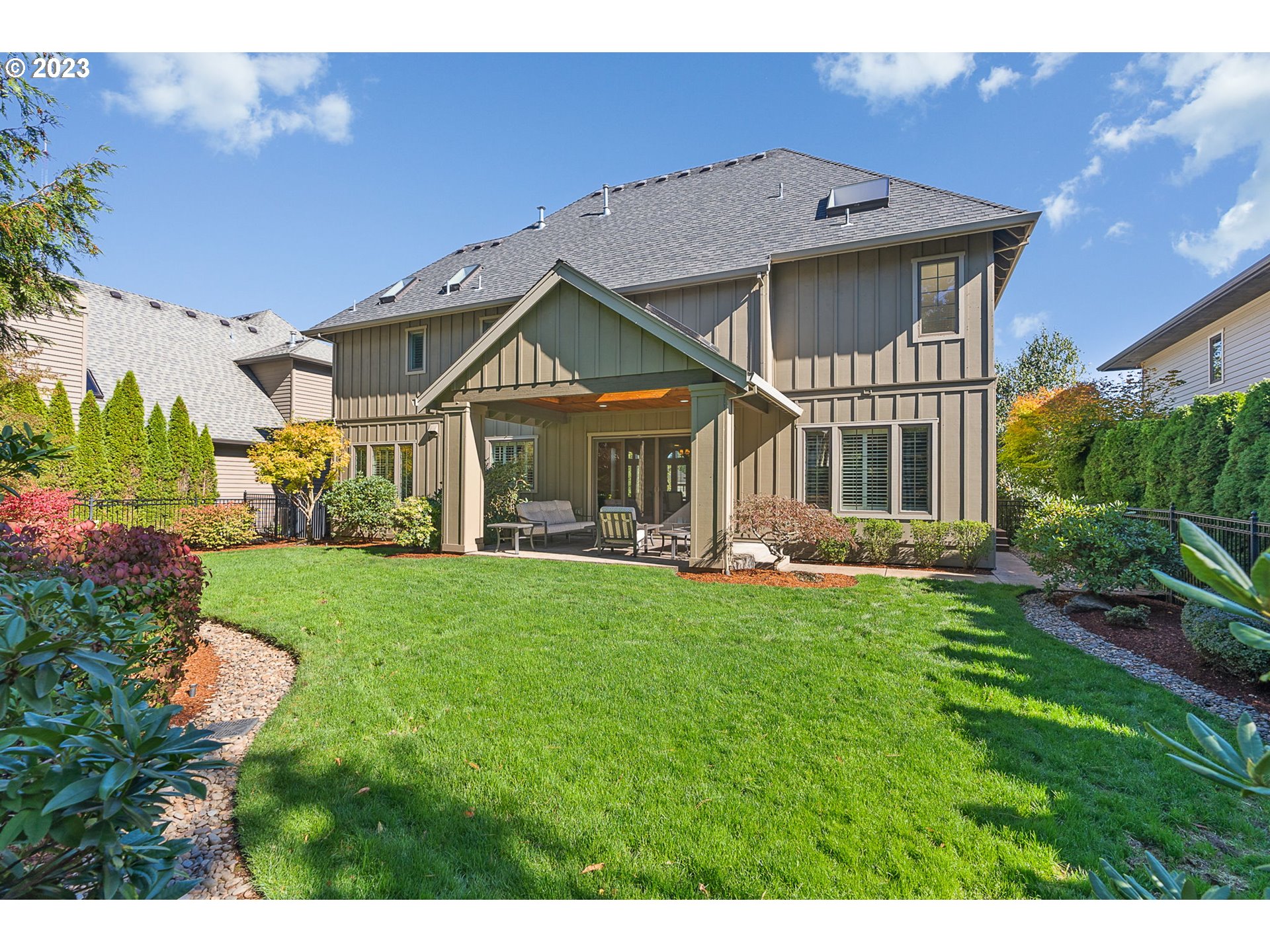 693 Southwest 68th Terrace Portland, OR 97225 - Photo 47 of 48 a front view of a house with a yard