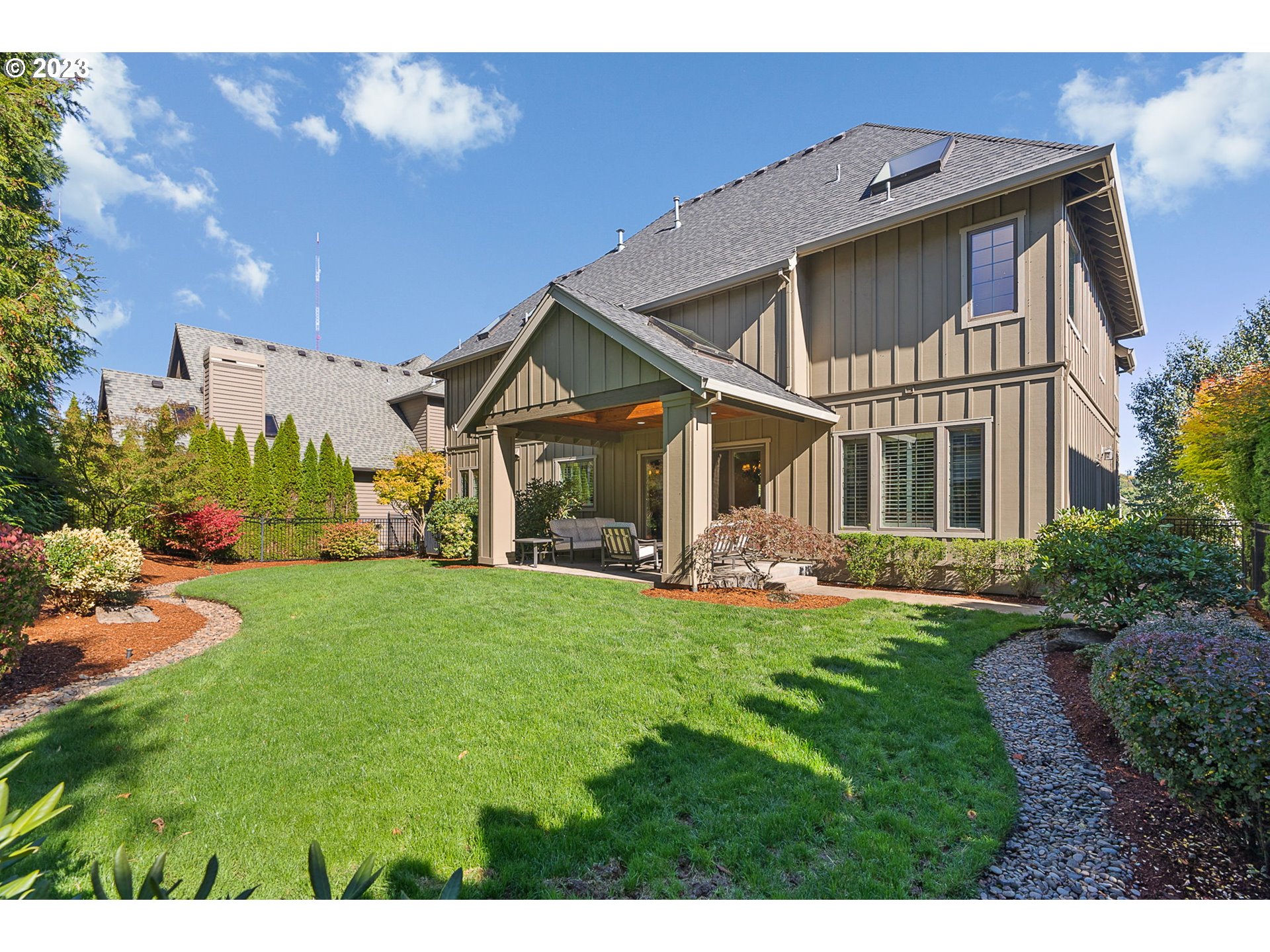 693 Southwest 68th Terrace Portland, OR 97225 - Photo 48 of 48 a front view of a house with a yard