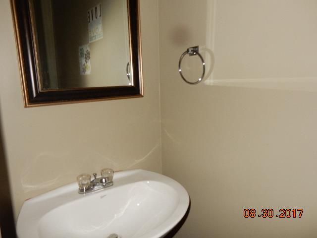 261 7 Mile Ferry Road Cunningham, TN 37052 - Photo 11 of 24 a bathroom with a sink and a mirror
