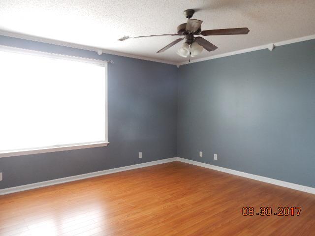 261 7 Mile Ferry Road Cunningham, TN 37052 - Photo 13 of 24 an empty room with a window and a ceiling fan