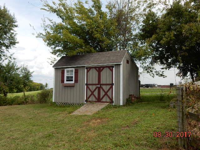 261 7 Mile Ferry Road Cunningham, TN 37052 - Photo 22 of 24 a backyard of a house with lots of green space