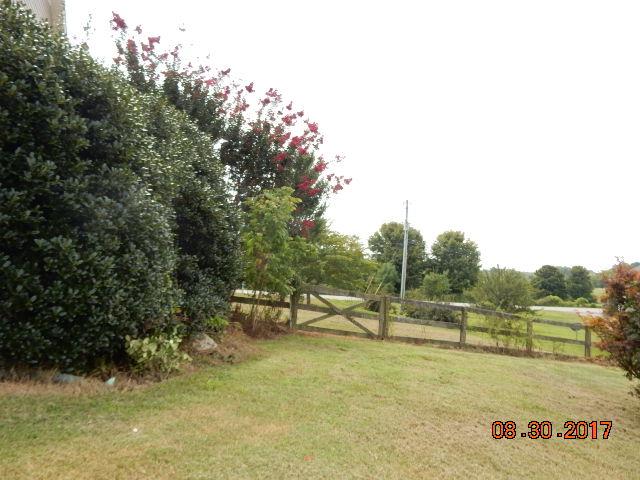 261 7 Mile Ferry Road Cunningham, TN 37052 - Photo 24 of 24 a view of a lake with a yard