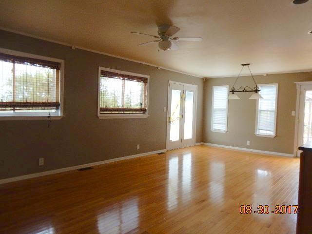 261 7 Mile Ferry Road Cunningham, TN 37052 - Photo 8 of 24 a view of an empty room with a window and wooden floor