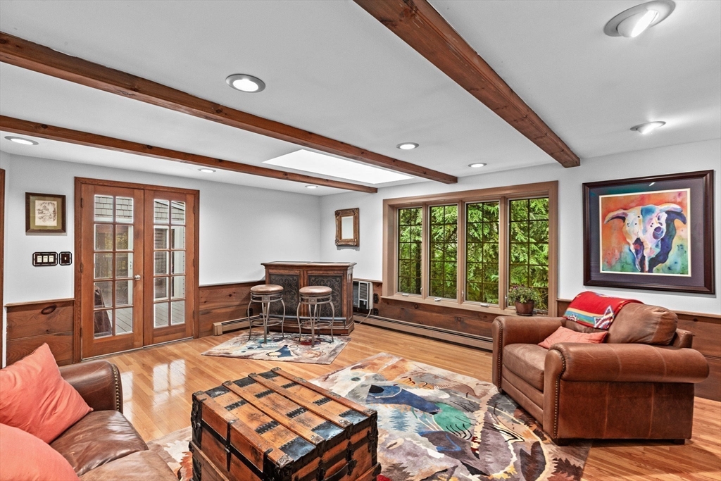 14 Camelot Drive Hingham, MA 02043 - Photo 12 of 34 a living room with furniture a rug and a large window