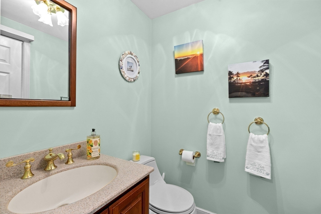 14 Camelot Drive Hingham, MA 02043 - Photo 16 of 34 a bathroom with a sink vanity mirror and toilet