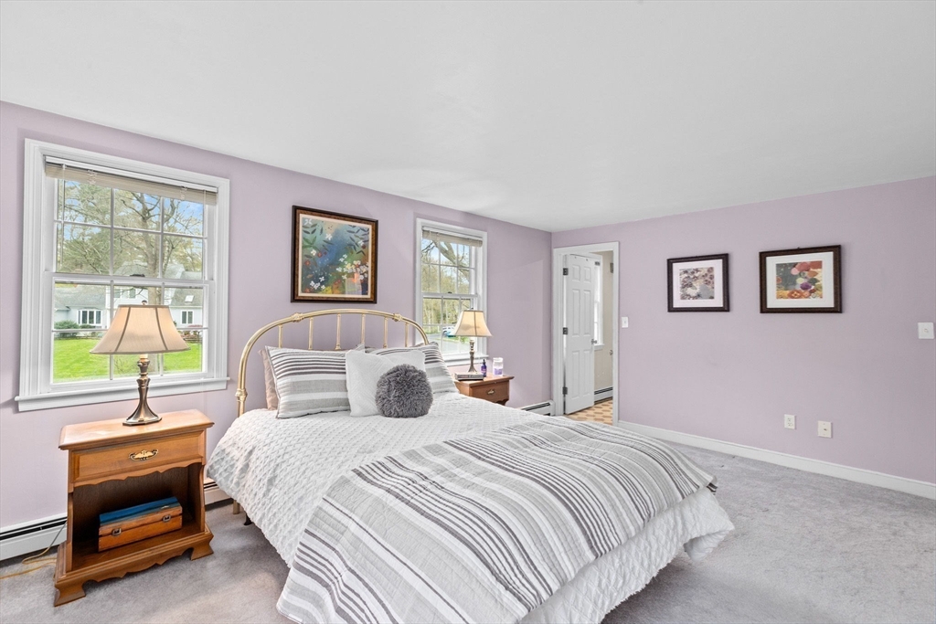 14 Camelot Drive Hingham, MA 02043 - Photo 18 of 34 a bedroom with a large bed and a window