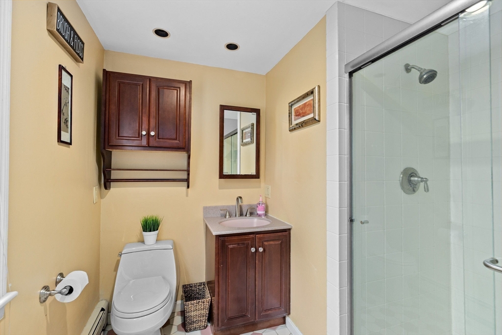 14 Camelot Drive Hingham, MA 02043 - Photo 20 of 34 a bathroom with a granite countertop sink toilet and mirror