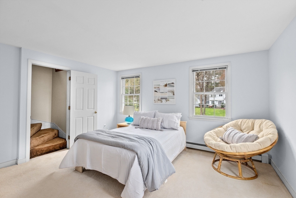 14 Camelot Drive Hingham, MA 02043 - Photo 22 of 34 a bedroom with a bed and a chair