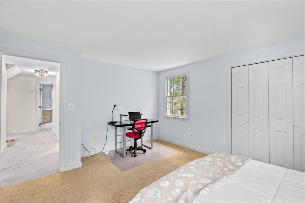 14 Camelot Drive Hingham, MA 02043 - Photo 27 of 34 a bedroom with a bed and a chair
