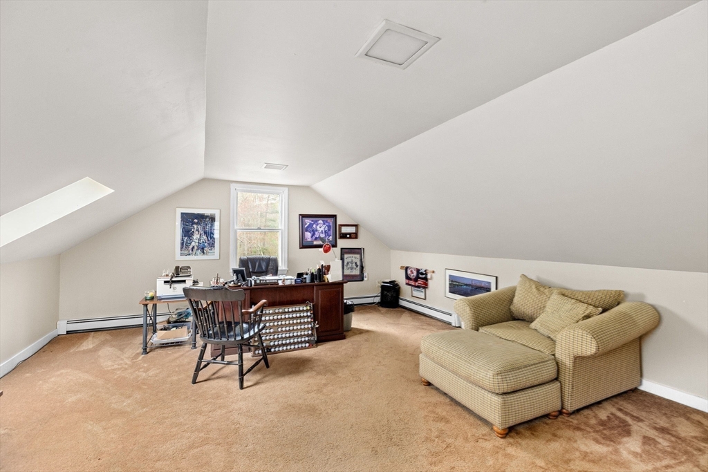 14 Camelot Drive Hingham, MA 02043 - Photo 29 of 34 a living room with furniture and a dining table with wooden floor