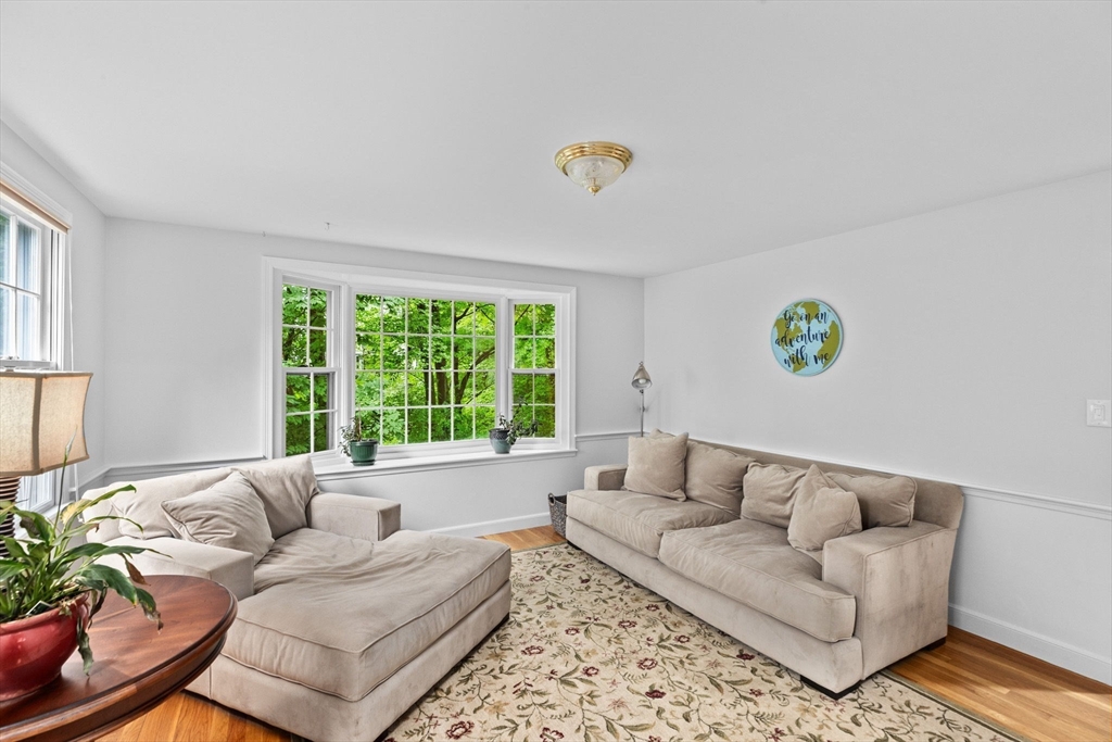 14 Camelot Drive Hingham, MA 02043 - Photo 9 of 34 a living room with furniture and a large window