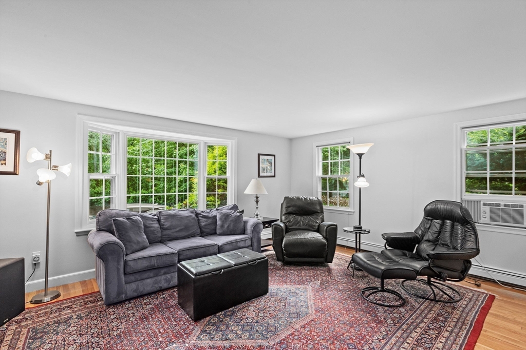 14 Camelot Drive Hingham, MA 02043 - Photo 10 of 34 a living room with furniture and a large window