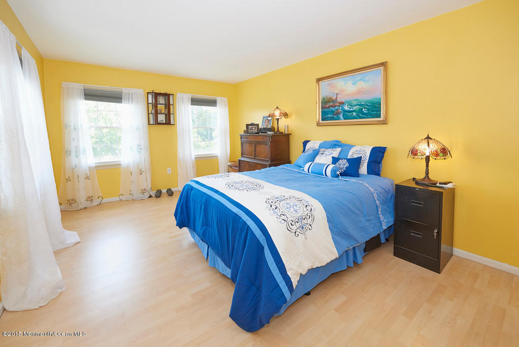 12 Bay Hill Road Middletown, NJ 07737 - Photo 26 of 30 a bedroom with a bed and a couch