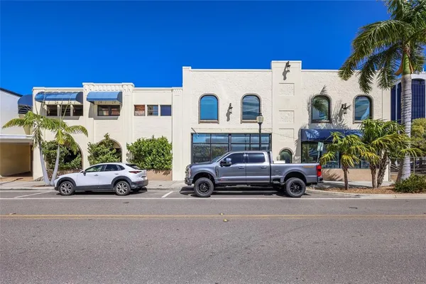 a view of a car parked in front of a house
