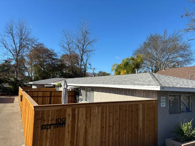 a view of a swimming pool with a yard