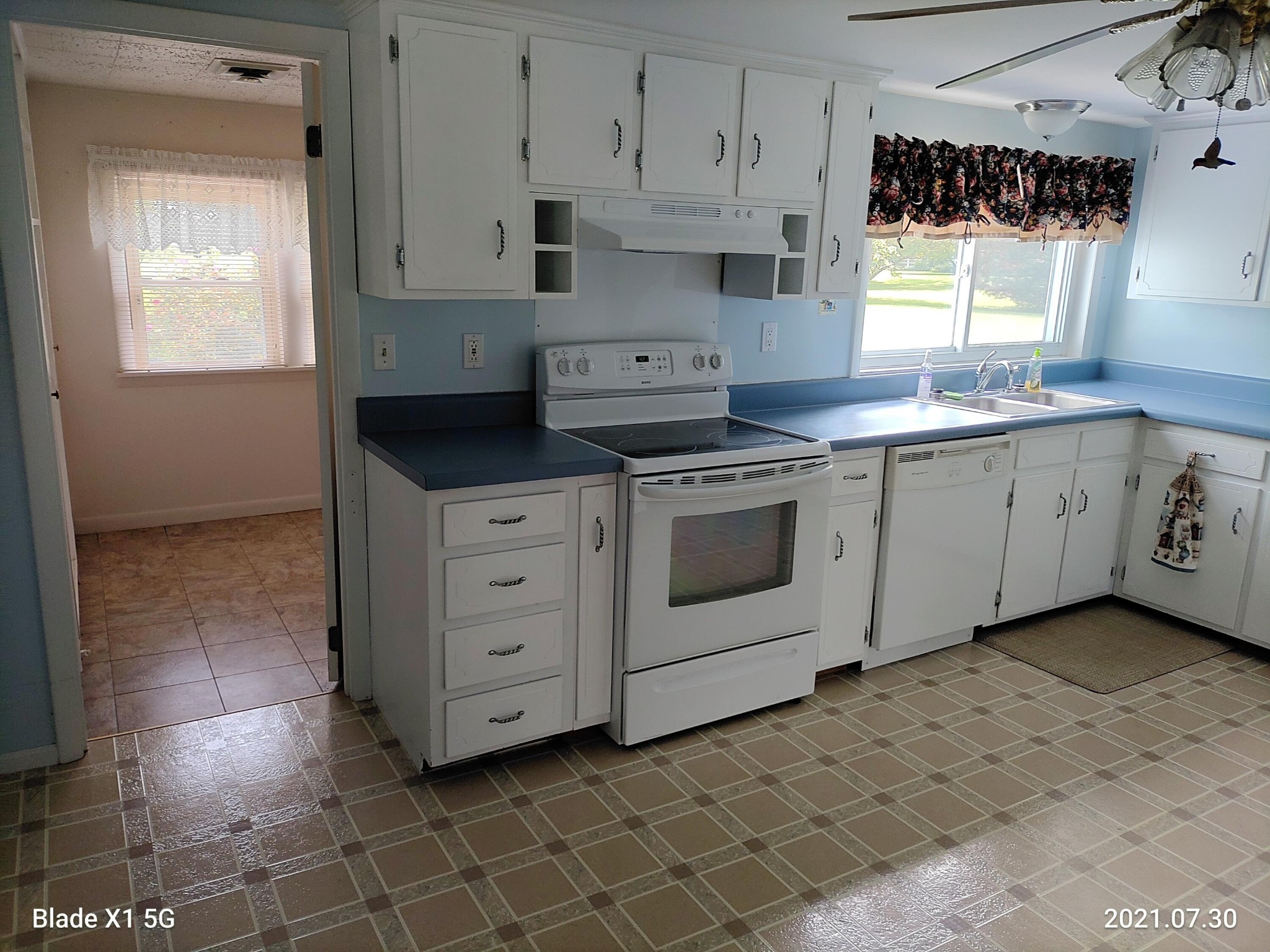 1764 Plateau Road Crossville, TN 38571 - Photo 8 of 38 a kitchen with cabinets appliances and a window
