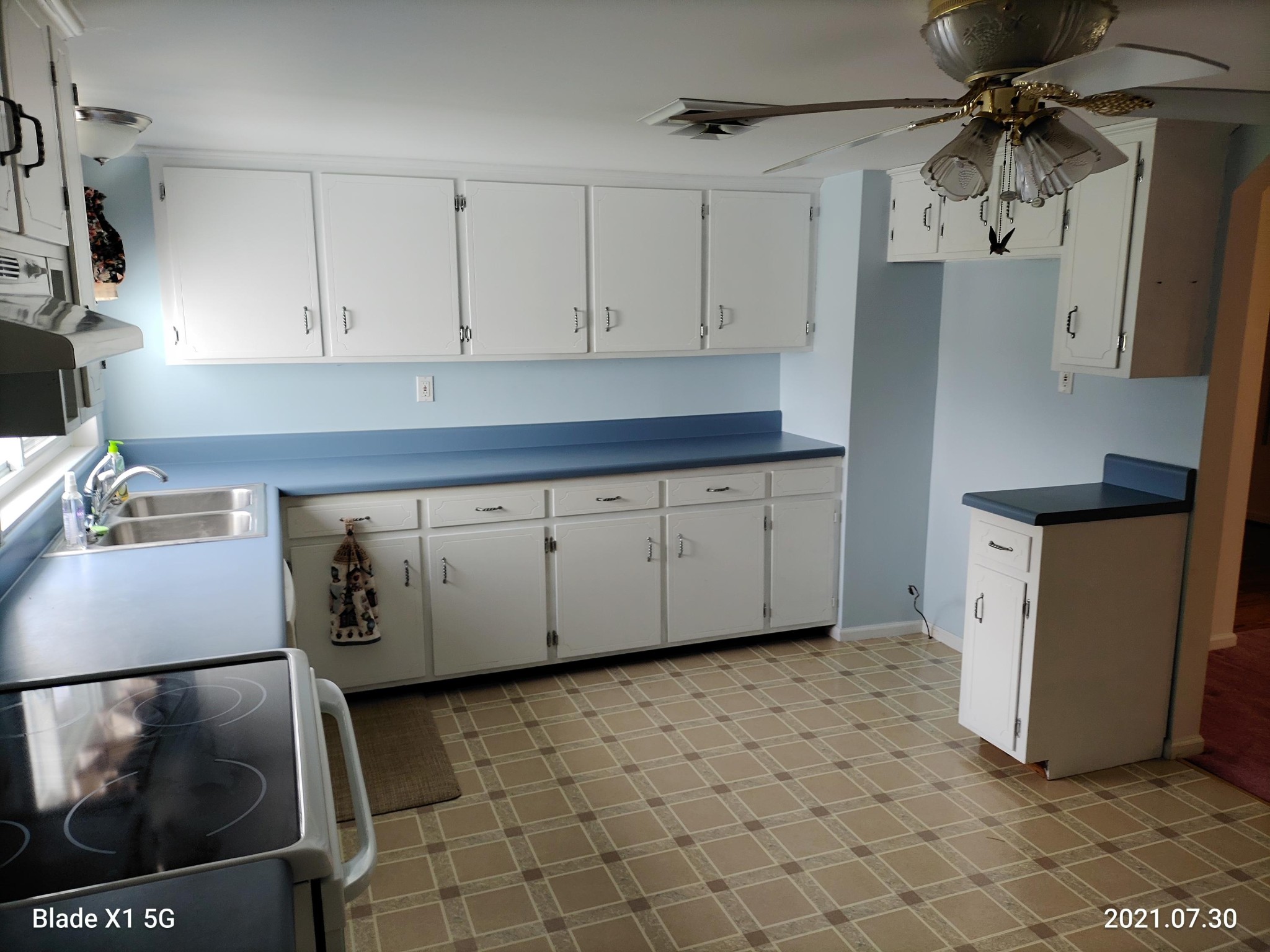 1764 Plateau Road Crossville, TN 38571 - Photo 9 of 38 a kitchen with a sink a refrigerator and cabinets