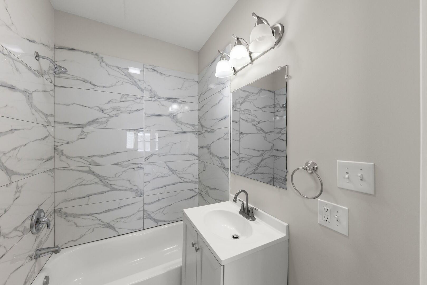 12012 South Michigan Avenue Chicago, IL 60628 - Photo 12 of 28 a bathroom with a sink a toilet and shower