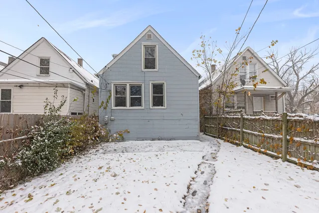 a view of a brick house with large windows