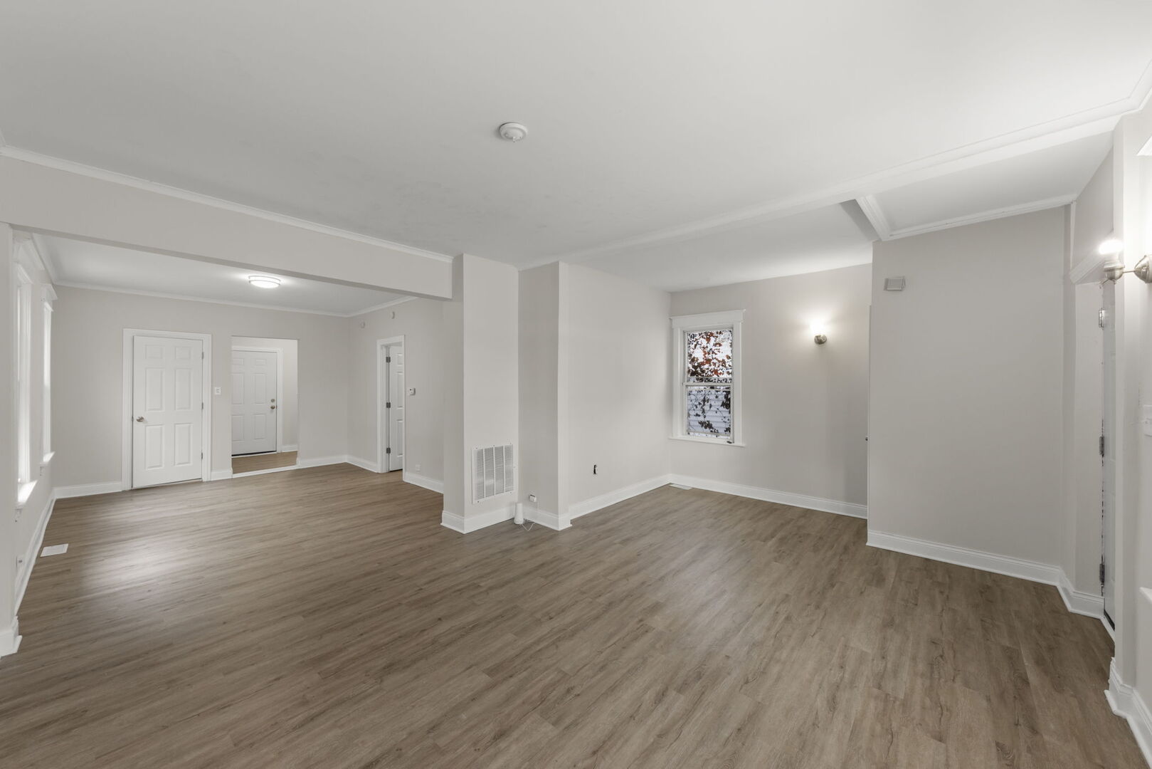 12012 South Michigan Avenue Chicago, IL 60628 - Photo 3 of 28 a view of an empty room with wooden floor