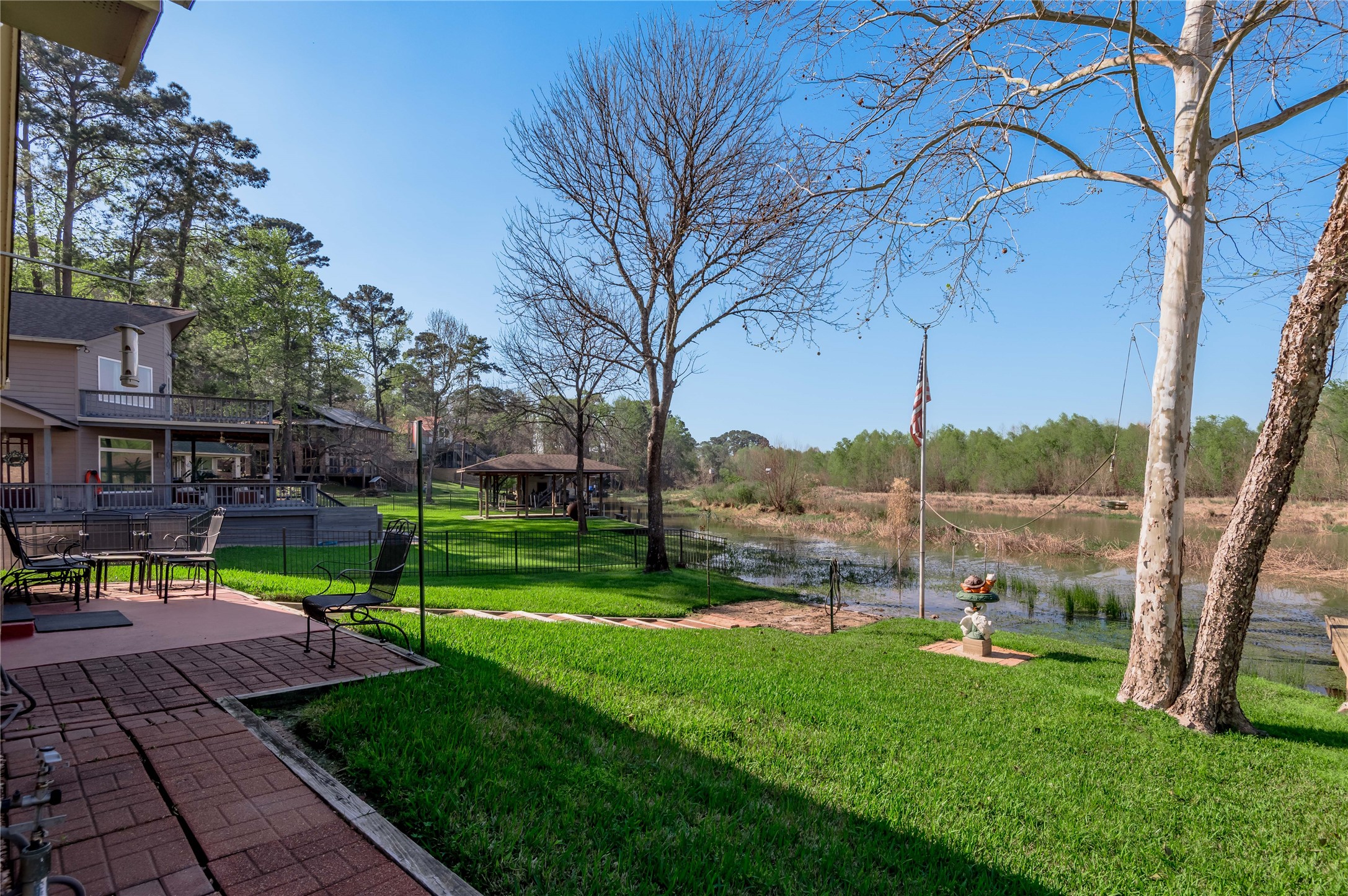 15 Lake Side Trinity, TX 75862 - Photo 30 of 33 a view of a patio with a table chairs and a fire pit