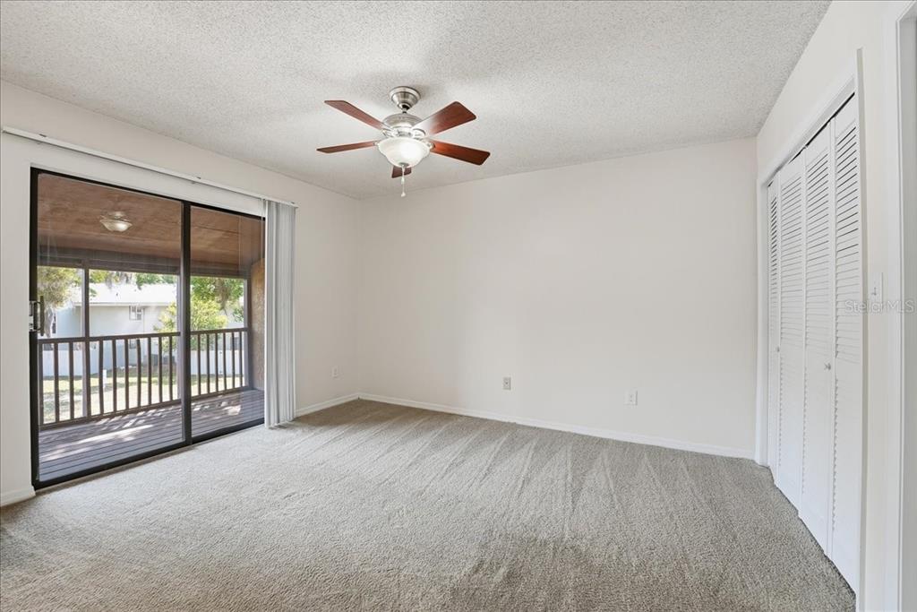 1428 Oak Place, Unit C Apopka, FL 32712 - Photo 7 of 16 a view of an empty room with a window
