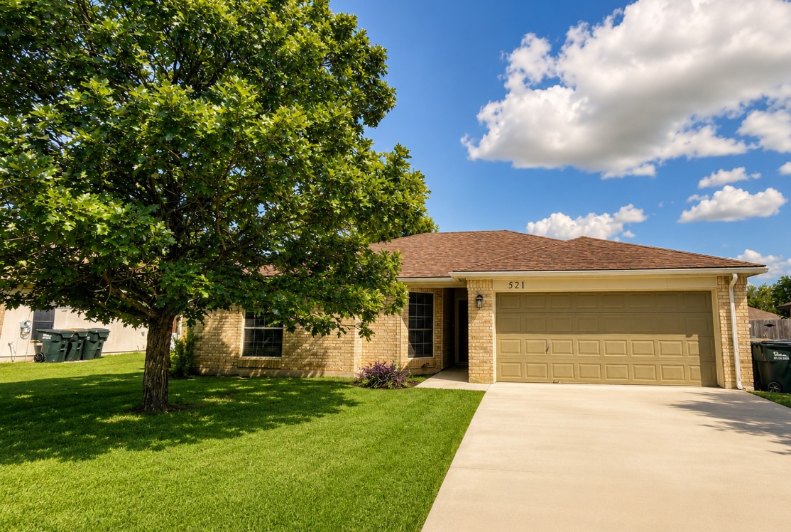 521 Britni Loop Kyle, TX 78640 - Photo 1 of 23 a front view of a house with a garden