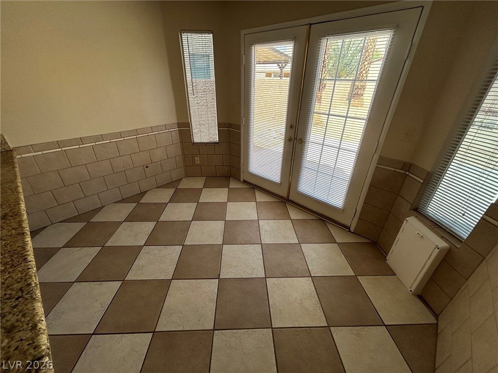 2806 Rungsted Street Las Vegas, NV 89142 - Photo 10 of 18 Checkerboard tile flooring complements the dual French doors opening to outdoor living.