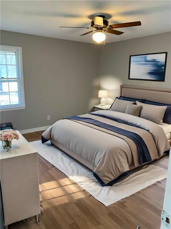 846 Idlewood Road Winder, GA 30680 - Photo 14 of 27 a bedroom with a bed and a chandelier