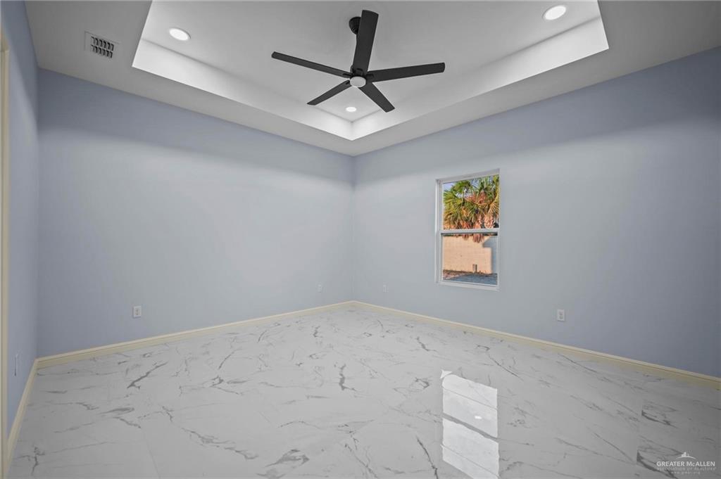 994 Rd Runner Street Rio Grande City, TX 78582 - Photo 11 of 17 en empty room with ceiling fan