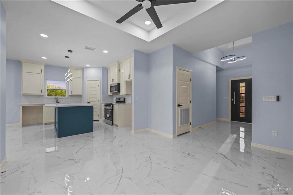 994 Rd Runner Street Rio Grande City, TX 78582 - Photo 17 of 17 a view of a kitchen with refrigerator and a sink