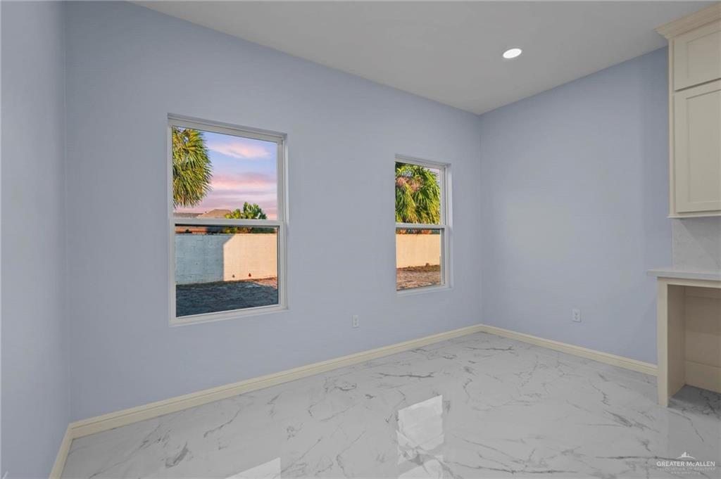 994 Rd Runner Street Rio Grande City, TX 78582 - Photo 9 of 17 an empty room with windows