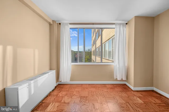 a view of an empty room and window