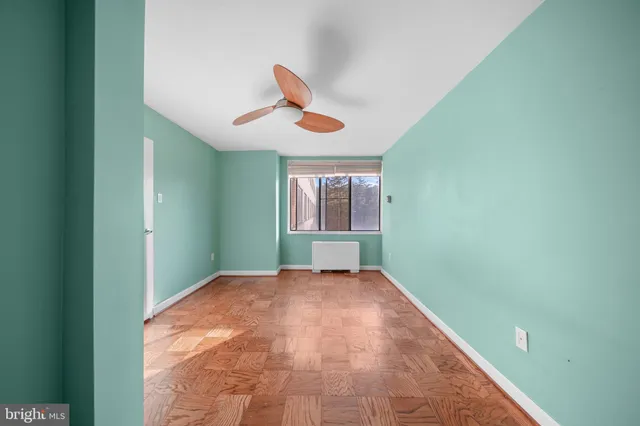 a view of an empty room with windows