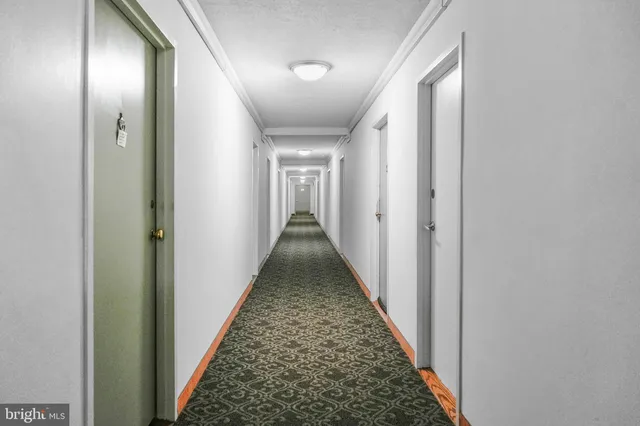 a view of a hallway with a staircase