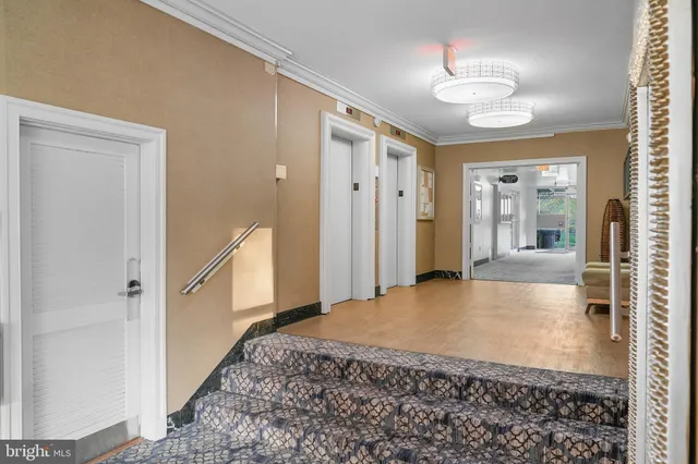 a view of a hallway with a chandelier