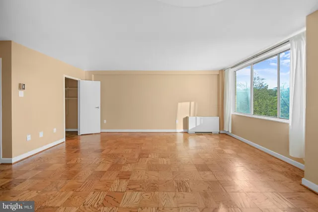 a view of an empty room with a window