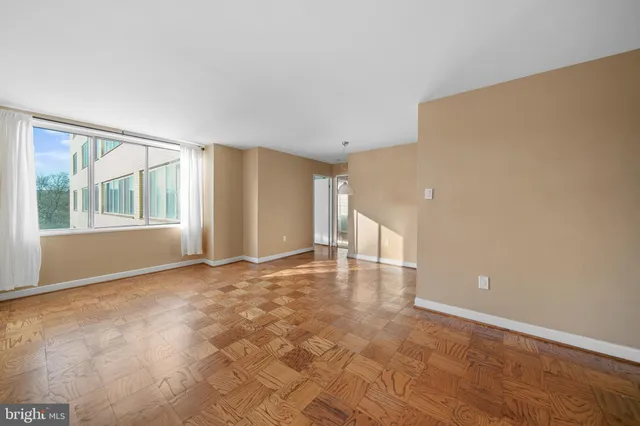 a view of an empty room with a window