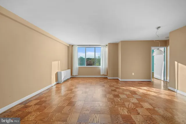 a view of an empty room with a window