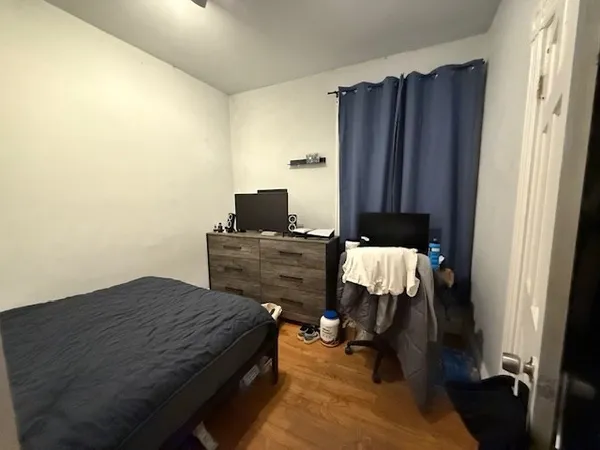 a bedroom with a bed and furniture